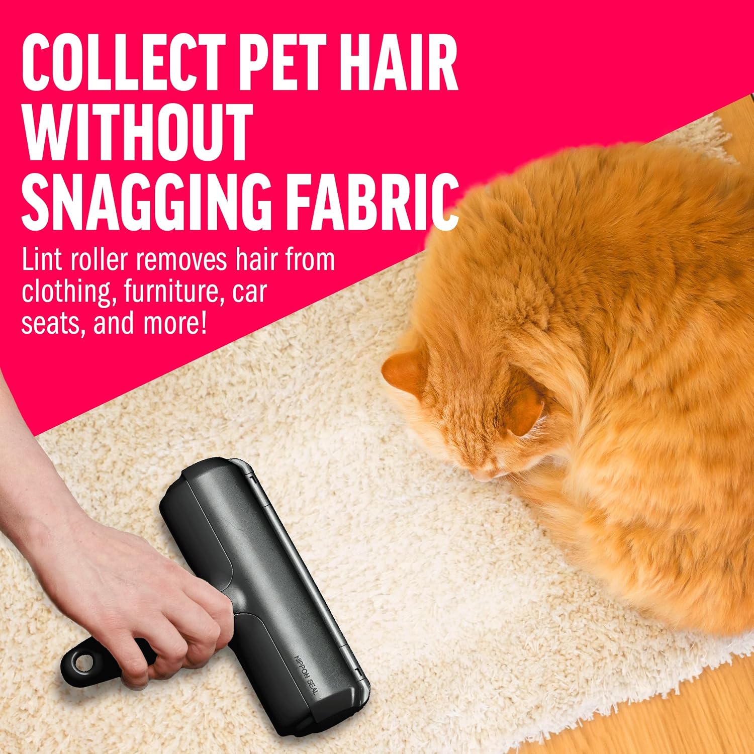 Hand rolling a black ChomChom Roller on a cream rug beside an orange cat